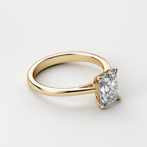 Elegant 14K or 18K yellow gold engagement ring with a radiant-cut diamond in a classic solitaire cathedral setting.
