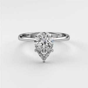 Elegant pear-shaped diamond engagement ring in 14K or 18K white gold, classic solitaire design on a white background.