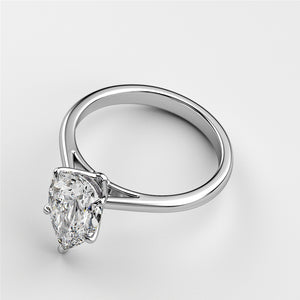 Elegant pear-shaped diamond engagement ring in 14K or 18K white gold, exuding timeless sophistication and classic romance.