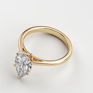 Elegant pear-shaped diamond engagement ring in 14K or 18K gold, showcasing exquisite clarity in a classic solitaire design.