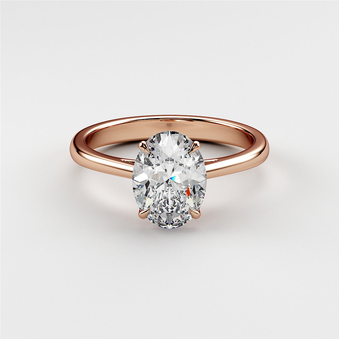 Elegant rose gold engagement ring featuring an oval diamond centerpiece, available in 14K, 18K, and platinum.|







#14KRecycledRoseGold
#18KRecycledRoseGold



