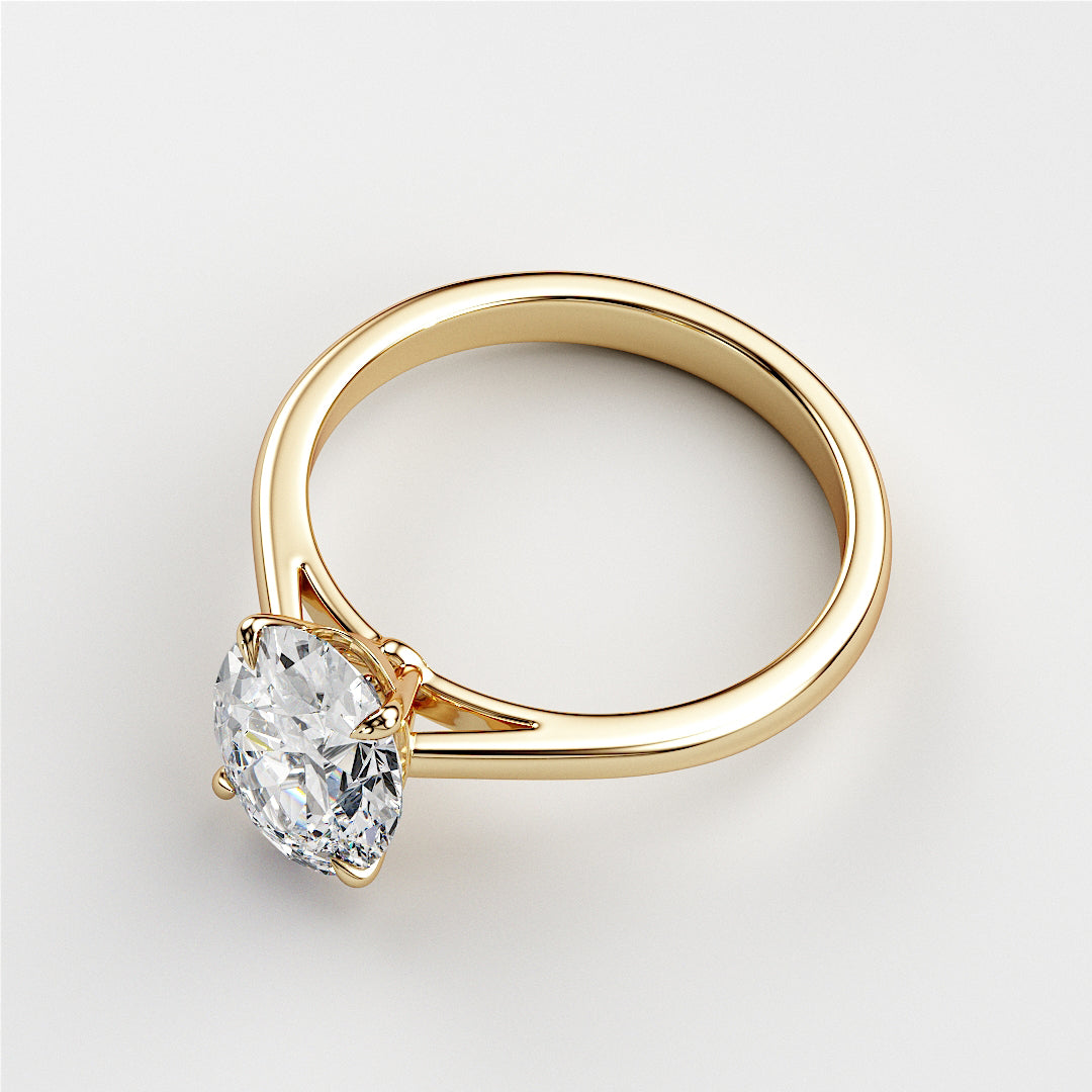 Elegant 14K yellow gold solitaire engagement ring with a brilliant round-cut diamond in a classic four-prong setting.|




#14KRecycledYellowGold
#18KRecycledYellowGold





