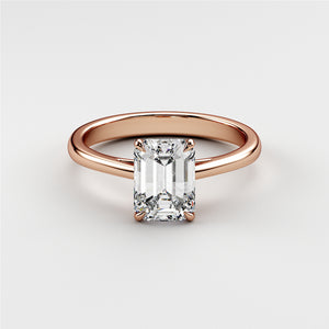 Emerald cut diamond engagement ring in 14K or 18K rose gold, elegant solitaire design on a plain background, perfect for engagements.