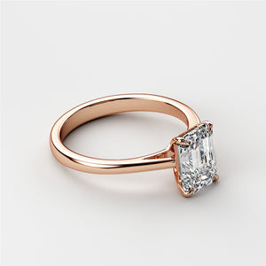 Elegant emerald-cut diamond engagement ring in 14K Rose Gold. A stunning solitaire for modern proposals and special moments.