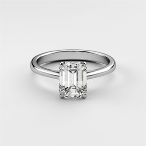 Stunning 14K or 18K white gold engagement ring featuring a radiant-cut emerald in a classic cathedral setting.