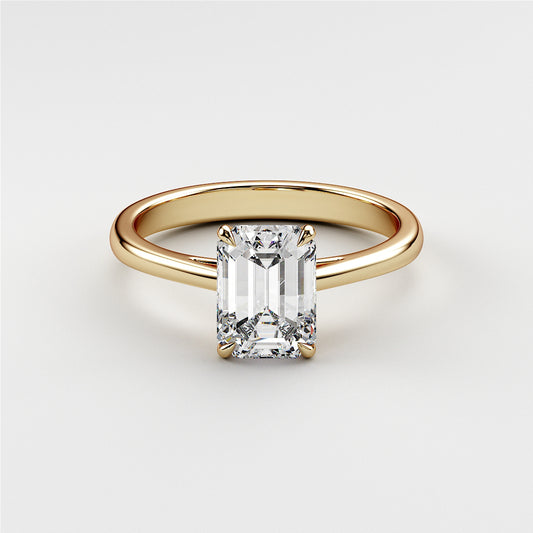 Elegant emerald-cut diamond engagement ring in 14K yellow gold, a timeless piece perfect for proposals and special occasions.