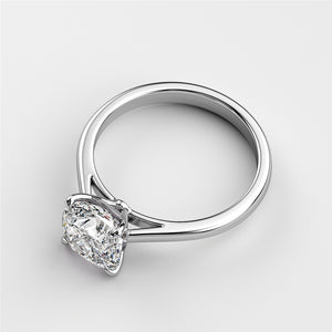 Elegant white gold solitaire engagement ring featuring a cushion-cut diamond, available in 14K or 18K options.