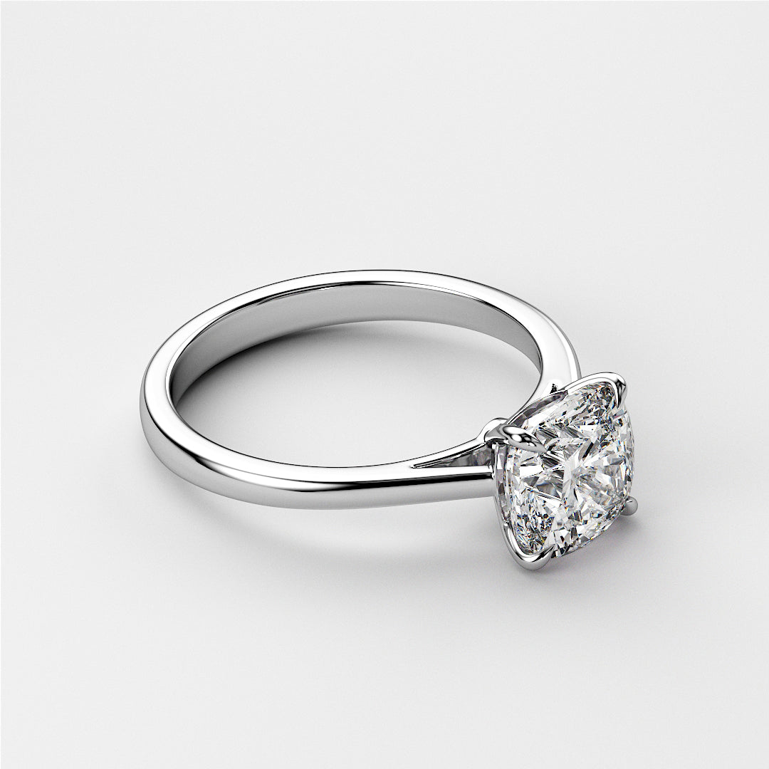 Elegant 14K/18K white gold cushion-cut diamond solitaire engagement ring, showcasing timeless sophistication and sparkling brilliance.