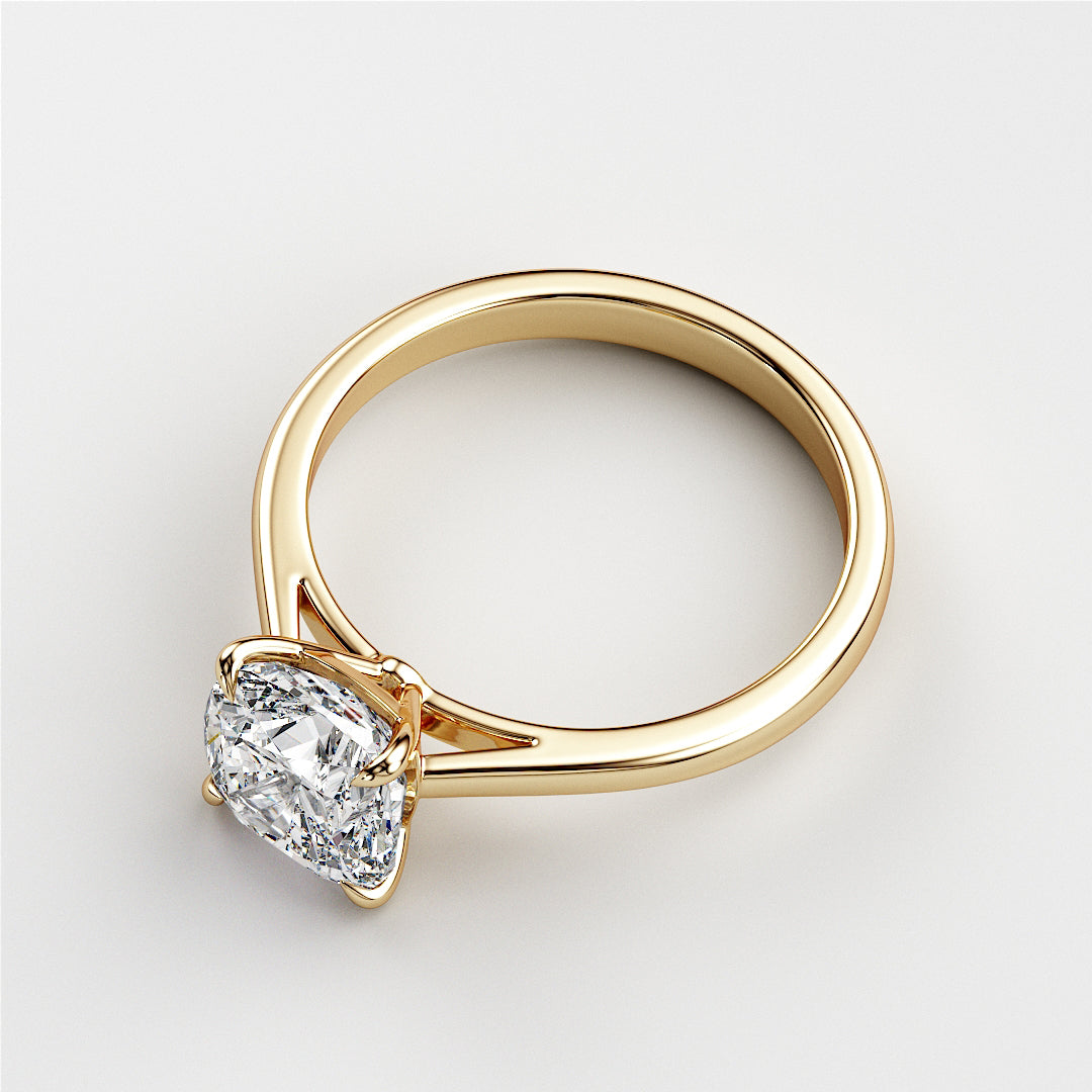Elegant 14K yellow gold engagement ring featuring a stunning cushion-cut diamond, displayed on a white background.
