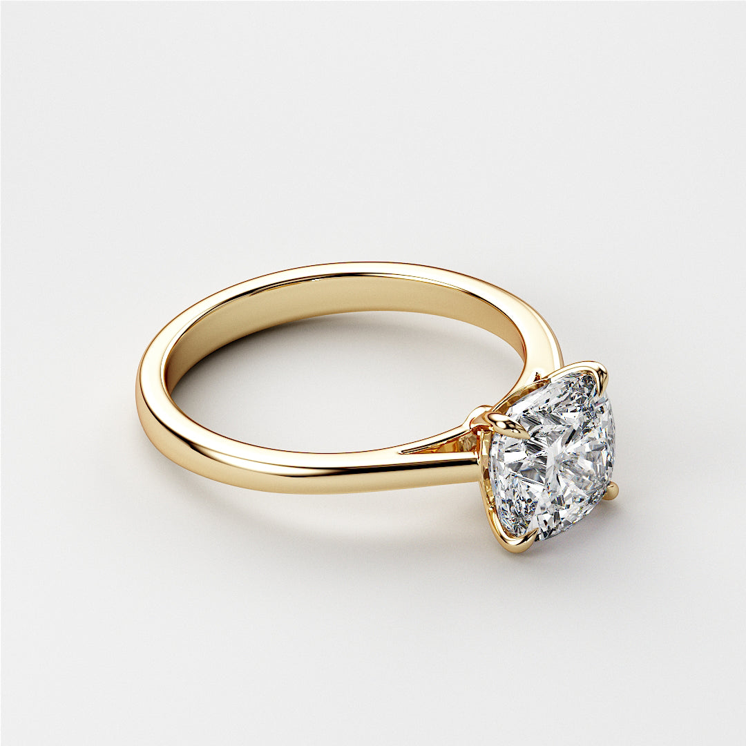 Elegant 14K yellow gold cushion-cut classic solitaire engagement ring featuring a stunning diamond in a cathedral setting.