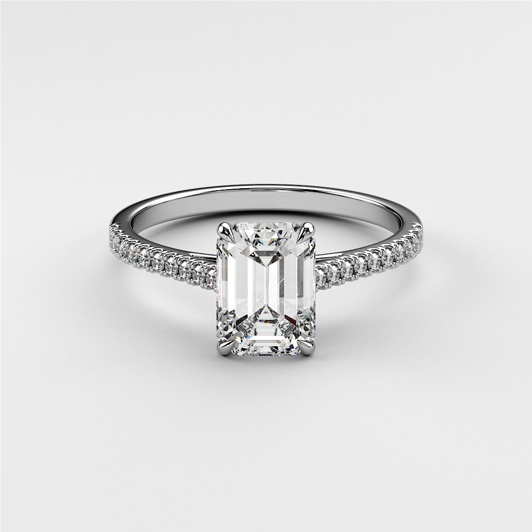 "14K or 18K white gold engagement ring featuring an emerald-cut diamond center stone and a pave diamond band."