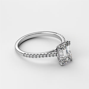 Elegant emerald-cut diamond engagement ring withPave band, available in 14K, 18K gold or platinum. Perfect for timeless elegance.