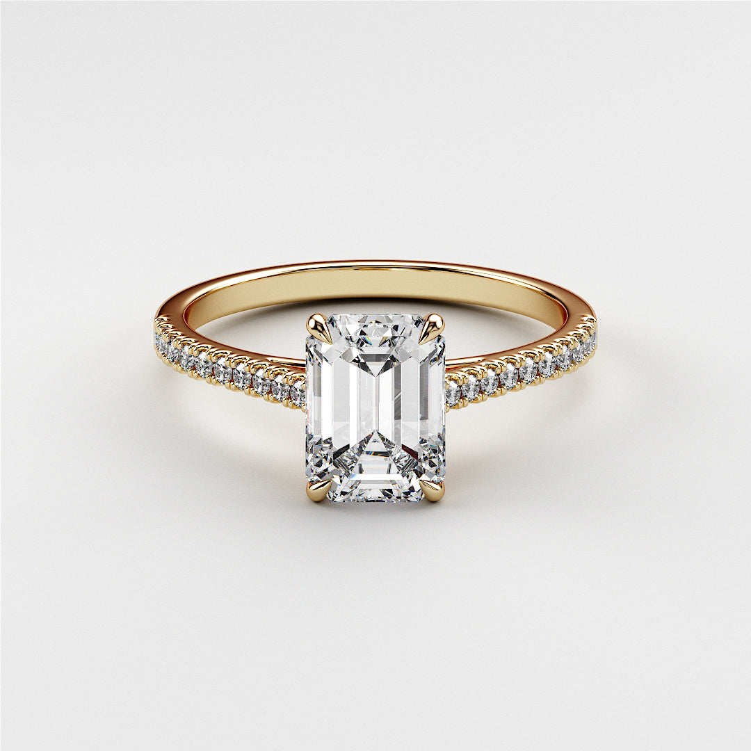 Elegant emerald-cut diamond engagement ring in a 14K yellow gold band, featuring intricate detailing and sparkling diamonds.|




#14KRecycledYellowGold
#18KRecycledYellowGold





