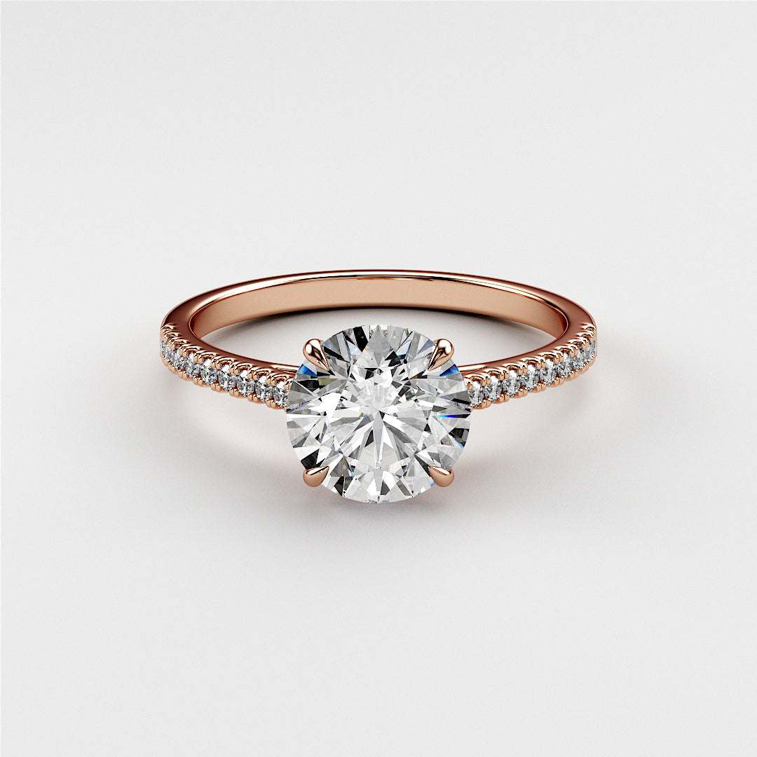 Elegant 14K and 18K rose gold engagement ring featuring a round diamond center stone and diamond-accented band.|







#14KRecycledRoseGold
#18KRecycledRoseGold


