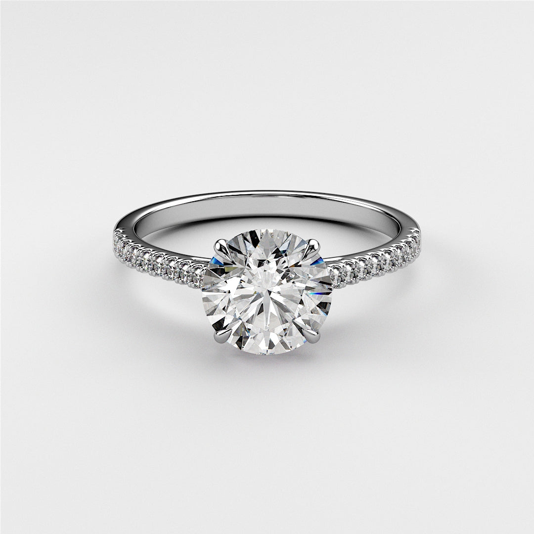"Elegant 14K or 18K white gold engagement ring with a round diamond and pave accents, showcasing timeless beauty."|

#14KRecycledWhiteGold
#18KRecycledWhiteGold








#Platinum