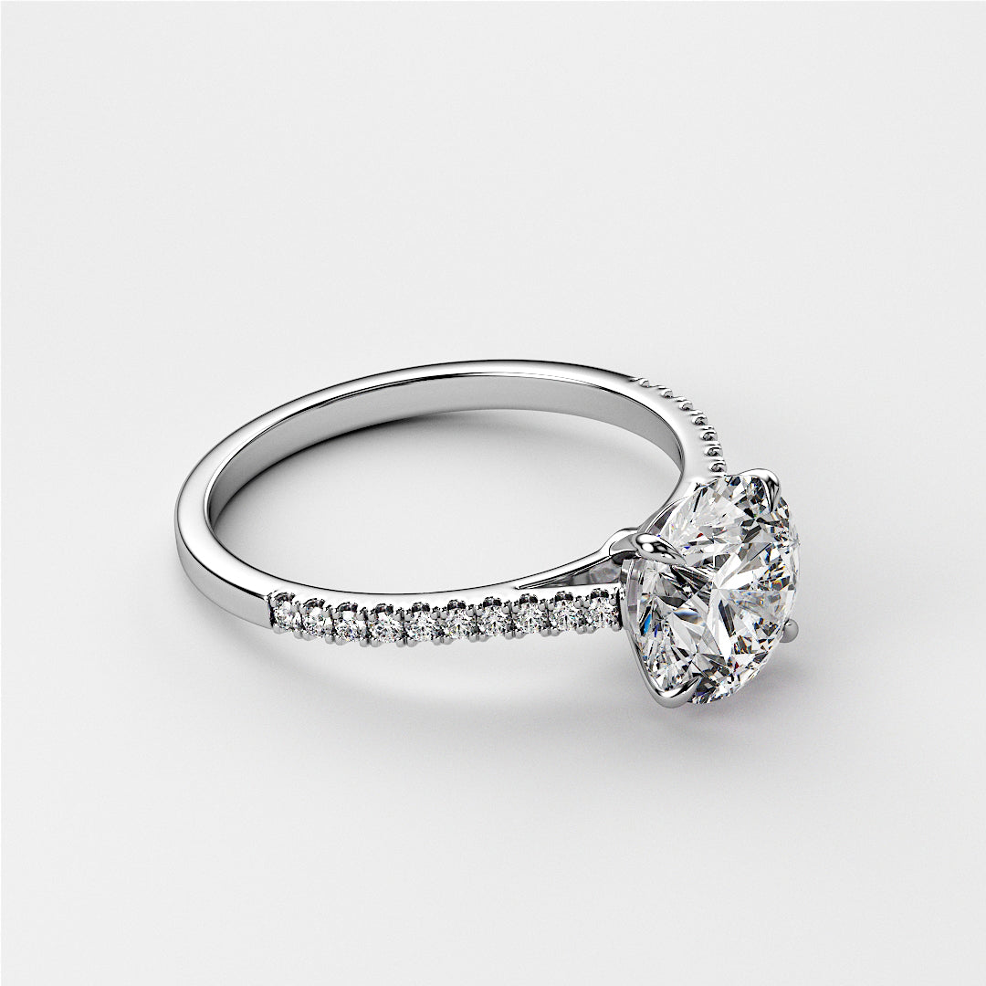 Elegant 14K white gold engagement ring featuring a round-cut diamond center stone and pave diamond band on a white background.|

#14KRecycledWhiteGold
#18KRecycledWhiteGold








#Platinum