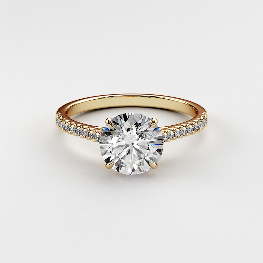 Elegant 14K or 18K gold engagement ring featuring a round-cut diamond and pave accents, ideal for proposals or special occasions.|




#14KRecycledYellowGold
#18KRecycledYellowGold





