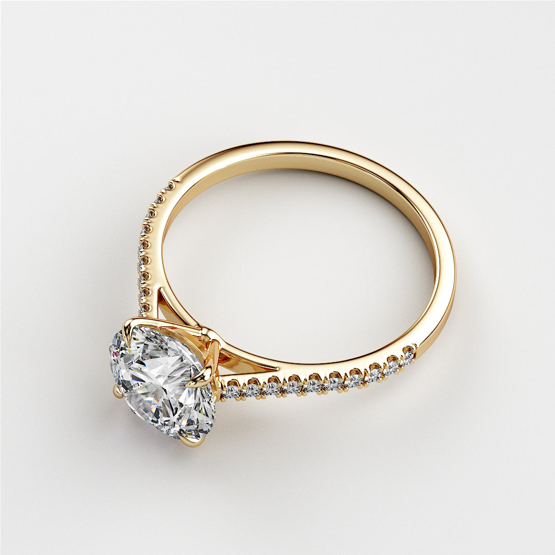 Elegant yellow gold engagement ring featuring an oval diamond center stone and delicate side diamonds, set in 14K or 18K.|




#14KRecycledYellowGold
#18KRecycledYellowGold





