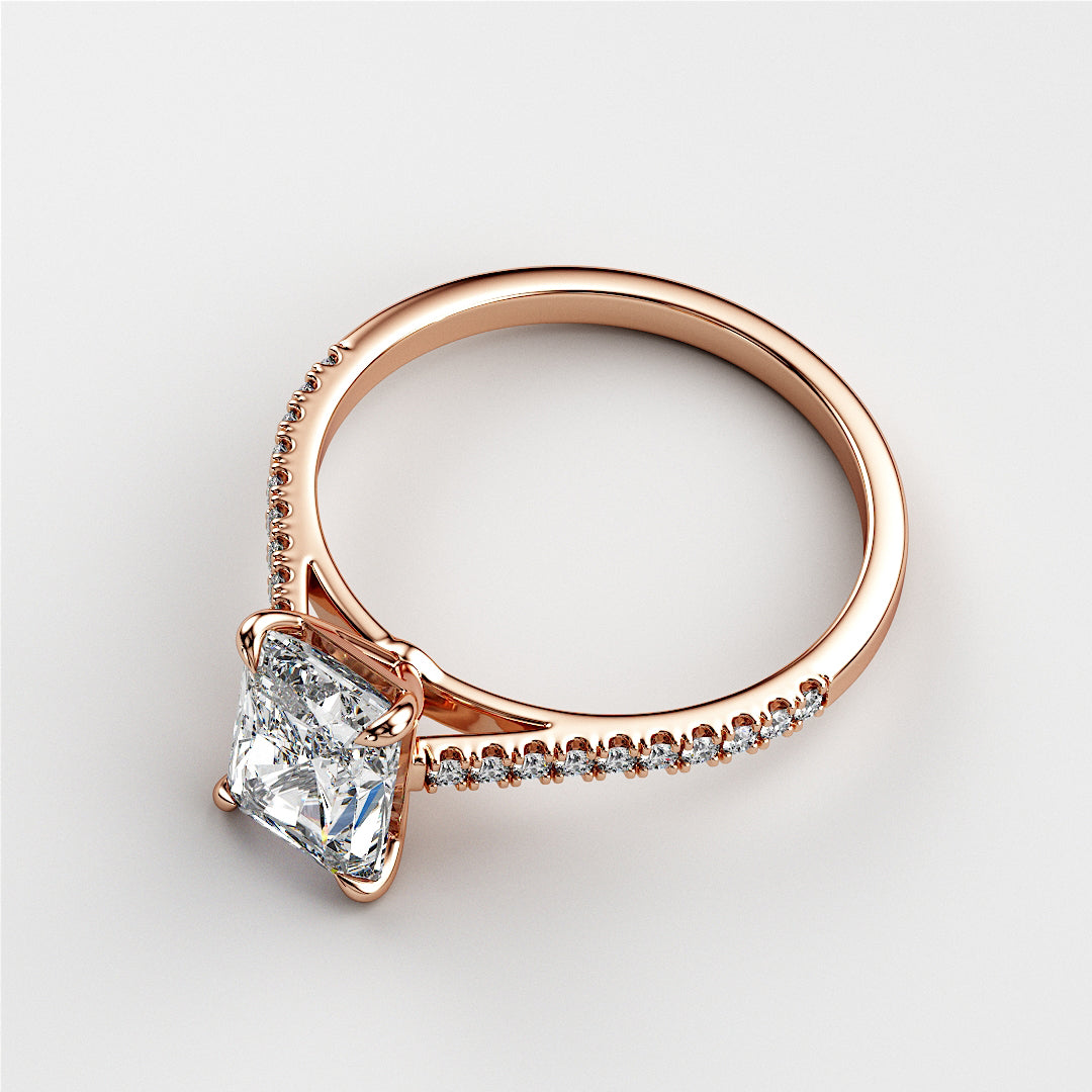 Elegant princess-cut diamond engagement ring in 14K rose gold, featuring a radiant solitaire diamond and a delicate pave band.|







#14KRecycledRoseGold
#18KRecycledRoseGold


