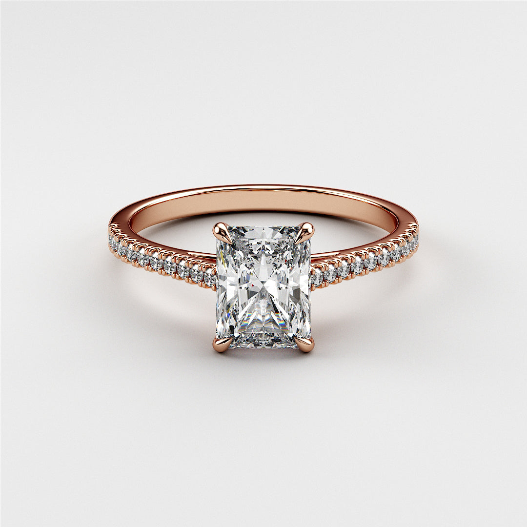 Radiant-cut diamond engagement ring in 14K rose gold, adorned with small diamonds for added brilliance and elegance.|







#14KRecycledRoseGold
#18KRecycledRoseGold


