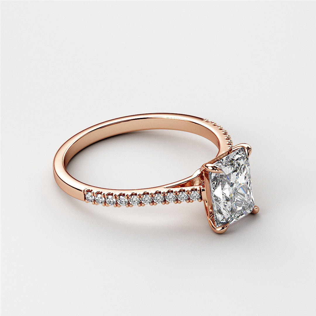 14K rose gold engagement ring with radiant-cut diamond and diamond-studded band, showcasing elegant craftsmanship. Not worn on model.|







#14KRecycledRoseGold
#18KRecycledRoseGold


