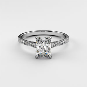 Elegant white gold engagement ring with radiant-cut diamond and pave accents, available in 14K, 18K gold, or platinum.