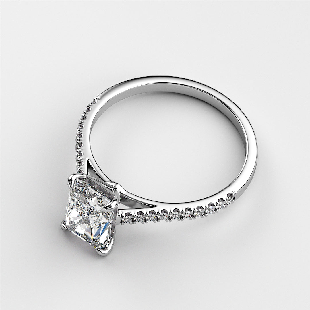 Elegant 14K gold engagement ring featuring a radiant cushion-cut diamond and pave diamonds, shown off-model.|

#14KRecycledWhiteGold
#18KRecycledWhiteGold








#Platinum