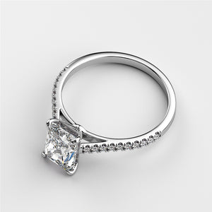 Elegant 14K gold engagement ring featuring a radiant cushion-cut diamond and pave diamonds, shown off-model.