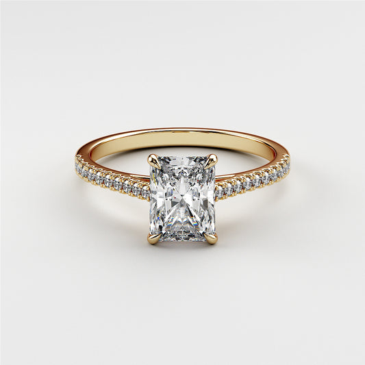 Radiant-cut diamond engagement ring with pave band in 14K or 18K yellow gold or platinum. Elegant and stunning design.