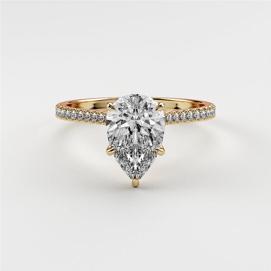 Pear-shaped diamond engagement ring withPave band in 14K or 18K gold or platinum on white background.