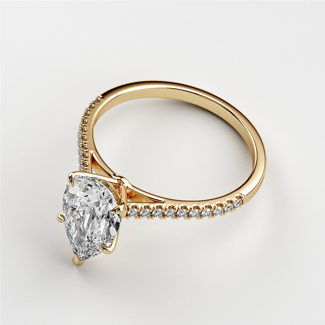 "Luxurious 14K or 18K gold pear solitairePave cathedral engagement ring featuring a stunning diamond on a clean background."