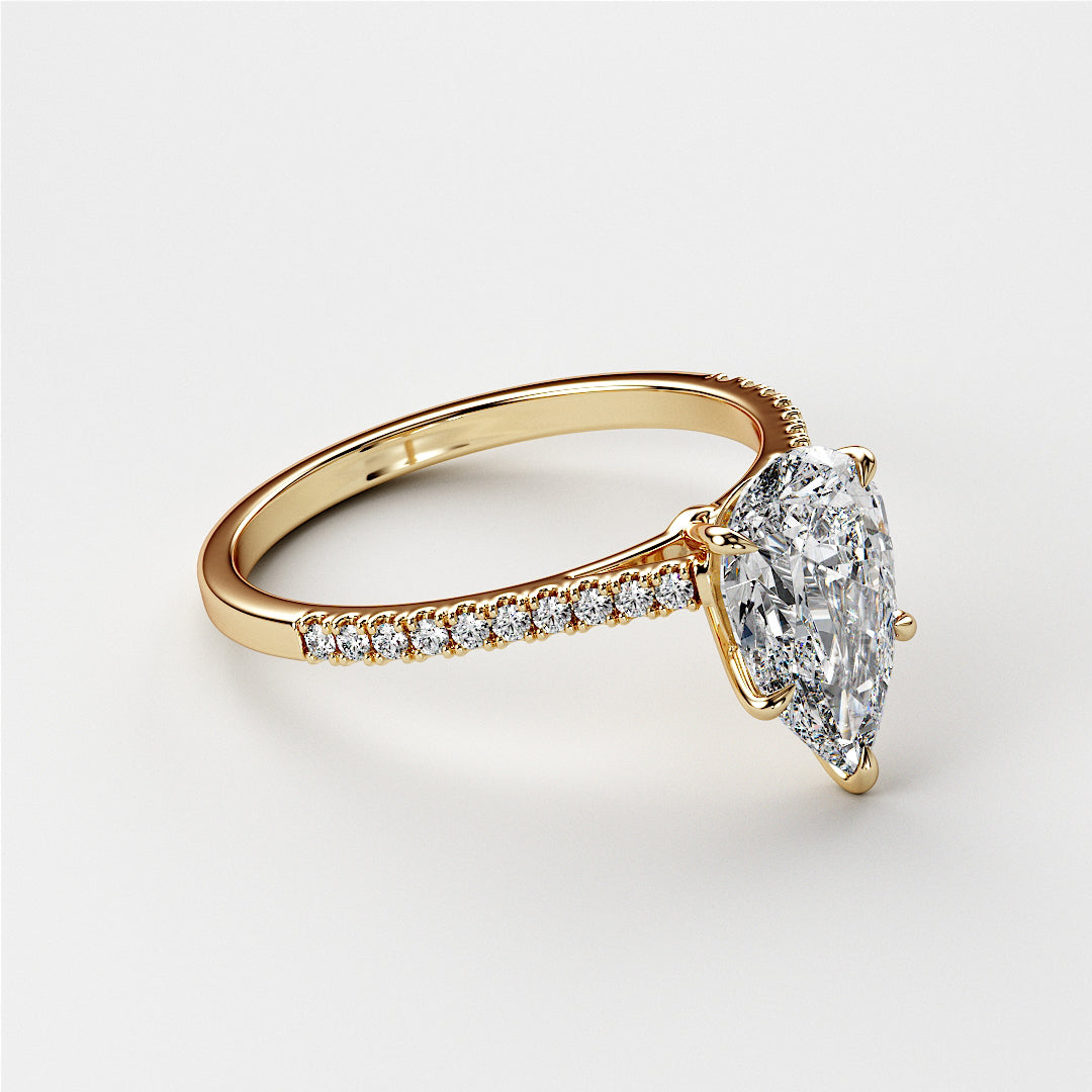 "Pear-shaped diamond engagement ring withPave band in 14K/18K gold or platinum, featuring a stunning diamond centerpiece."