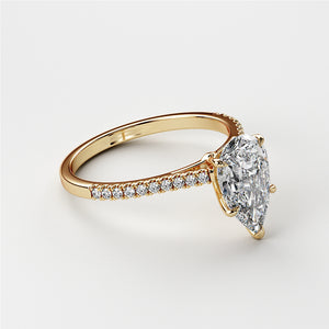 "Pear-shaped diamond engagement ring withPave band in 14K/18K gold or platinum, featuring a stunning diamond centerpiece."