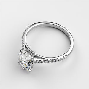 Luxury engagement ring featuring a marquise diamond set in a 14K white gold band with smaller diamonds, perfect for timeless elegance.