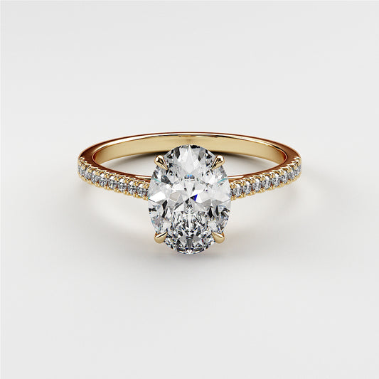 14K or 18K gold engagement ring featuring an elegant oval diamond center stone and a delicate pave band.