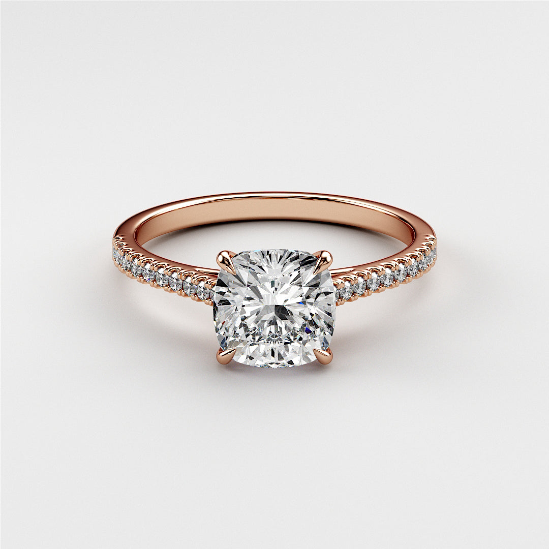Elegant rose gold cushion-cut diamond engagement ring withPave band, available in 14K, 18K, and platinum. Unworn on white background.