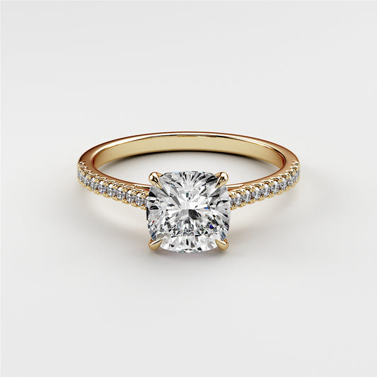 14K gold engagement ring featuring a radiant cushion-cut diamond andPave diamond band. Jewelry not worn on model.
