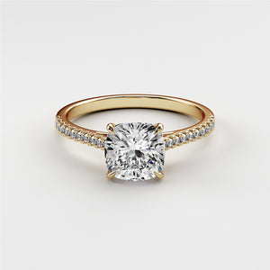 14K gold engagement ring featuring a radiant cushion-cut diamond andPave diamond band. Jewelry not worn on model.