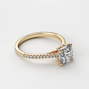Elegant 14K yellow gold engagement ring featuring a cushion-cut diamond and a sparkling diamond band. Ideal for unforgettable moments.
