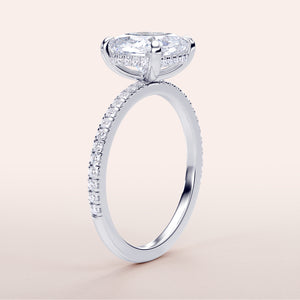 Elegant white gold engagement ring featuring a cushion-cut diamond in a hidden halo, withPave band, available in 14K and 18K options.