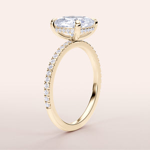 Elegant 14K yellow gold engagement ring with marquise-cut diamond centerpiece and pave band detailing. Perfect for proposals.