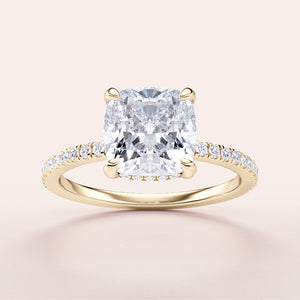 Elegant cushion cut diamond engagement ring with pave band, available in 14K or 18K gold or platinum.