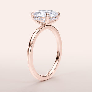 Elegant marquise diamond engagement ring in 14K rose gold, showcasing a thin band and stunning prong-set diamond.
