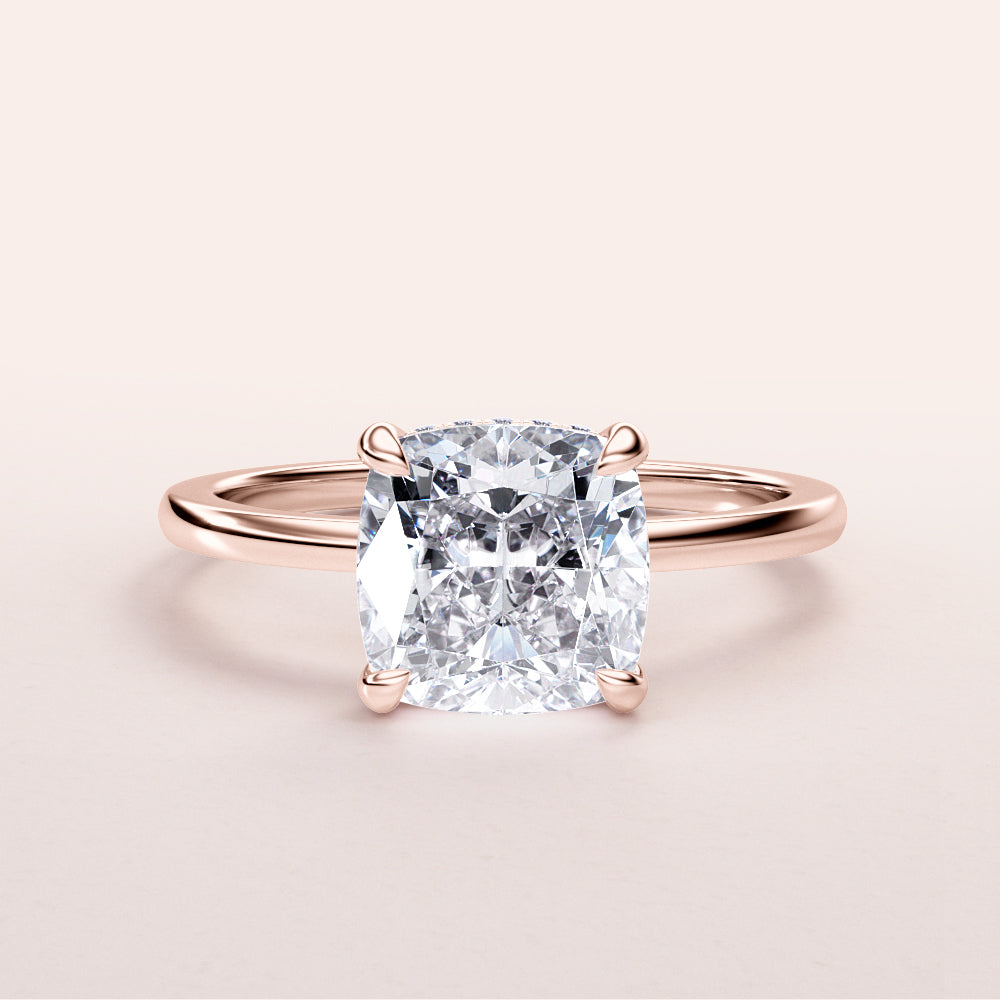 Elegant cushion-cut diamond engagement ring in sleek 14K rose gold with hidden halo and plain band.|







#14KRecycledRoseGold
#18KRecycledRoseGold


