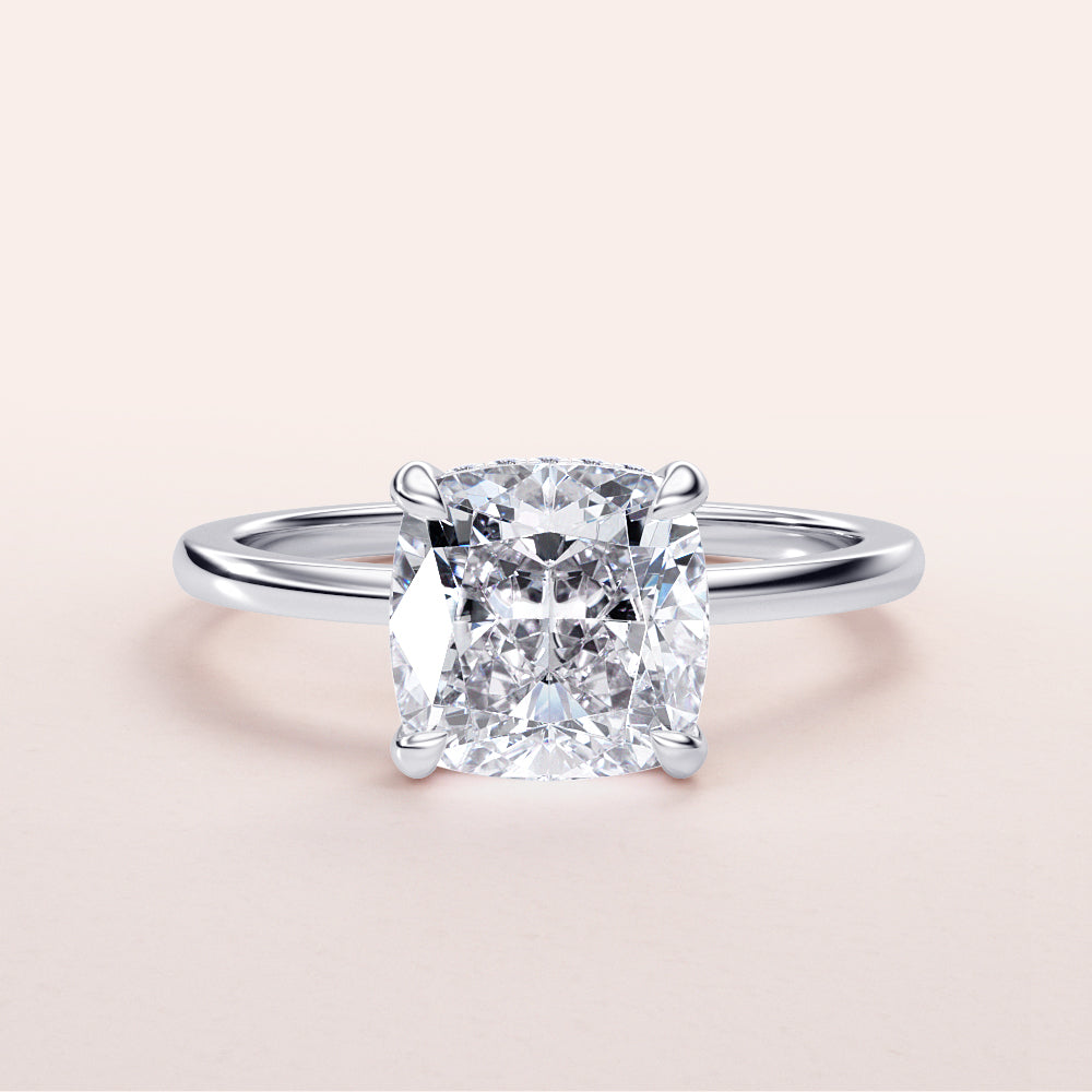 Radiant cushion-cut diamond engagement ring in a sleek 14K or 18K gold band, elegant hidden halo design for a stunning look.|

#14KRecycledWhiteGold
#18KRecycledWhiteGold








#Platinum