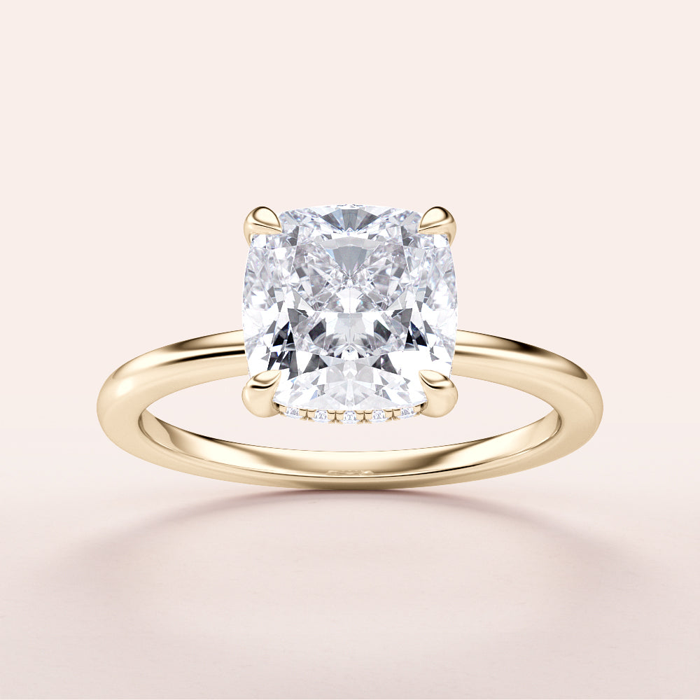 "Elegant yellow gold engagement ring featuring a cushion-cut diamond in a hidden halo design. Timeless luxury, perfect for proposals."|




#14KRecycledYellowGold
#18KRecycledYellowGold





