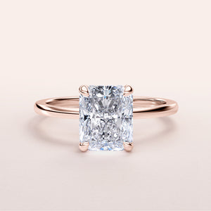 Radiant-cut diamond engagement ring in 14K rose gold, featuring a stunning halo and elegant solitaire design.