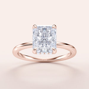 Elegant rose gold radiant cut diamond engagement ring, available in 14K, 18K, and platinum options.