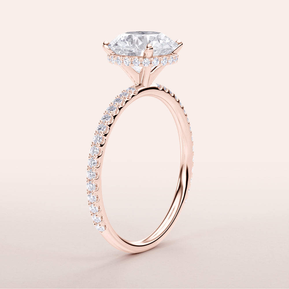 "Elegant Rose Gold engagement ring with round wrapped hidden halo and pave band, available in 14K, 18K, or platinum."