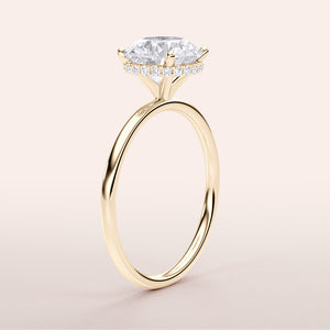Elegant 14K yellow gold wrapped halo engagement ring with a marquise diamond centerpiece and small diamond accents.